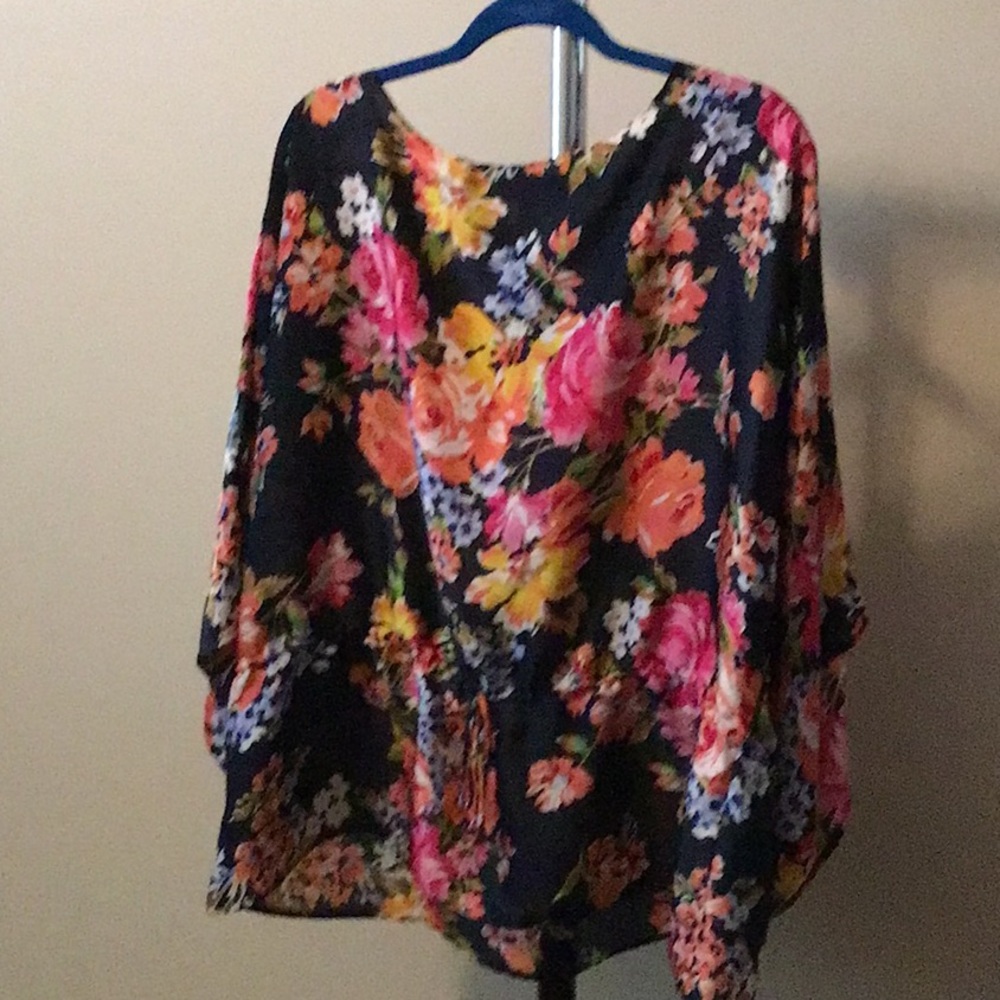 Sheer flowered top with drawstring waist.